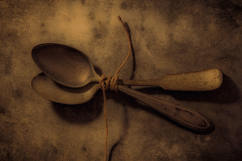 Two Spoons Bound Together